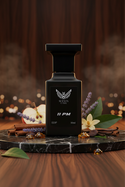 Black perfume bottle labeled '11 PM' by Scents of Evil on a white background